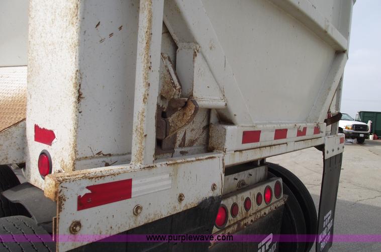 image for item C5704 1999 Clement 26' barrel end dump trailer