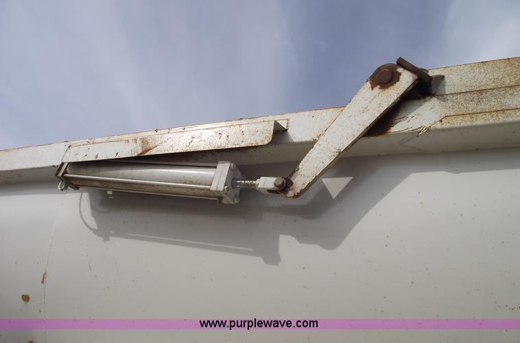 image for item C5704 1999 Clement 26' barrel end dump trailer