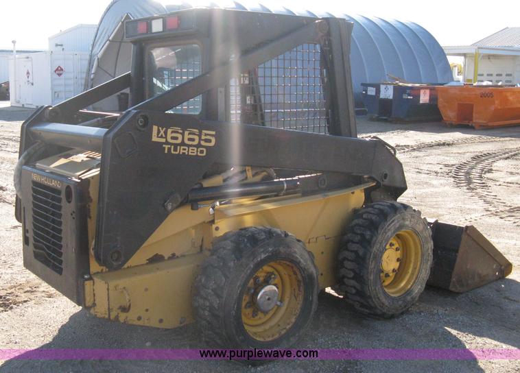 image for item A4472 1999 New Holland LX665 Turbo Super Boom skid loader