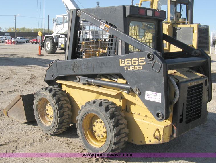 image for item A4472 1999 New Holland LX665 Turbo Super Boom skid loader