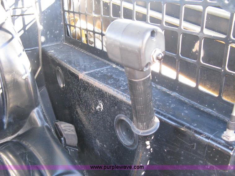 image for item A4472 1999 New Holland LX665 Turbo Super Boom skid loader