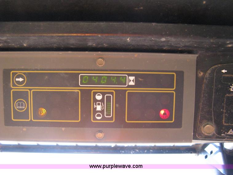 image for item A4472 1999 New Holland LX665 Turbo Super Boom skid loader