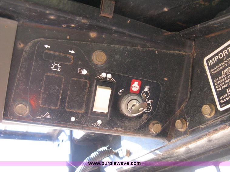 image for item A4472 1999 New Holland LX665 Turbo Super Boom skid loader