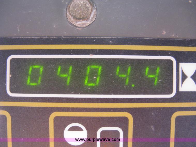 image for item A4472 1999 New Holland LX665 Turbo Super Boom skid loader