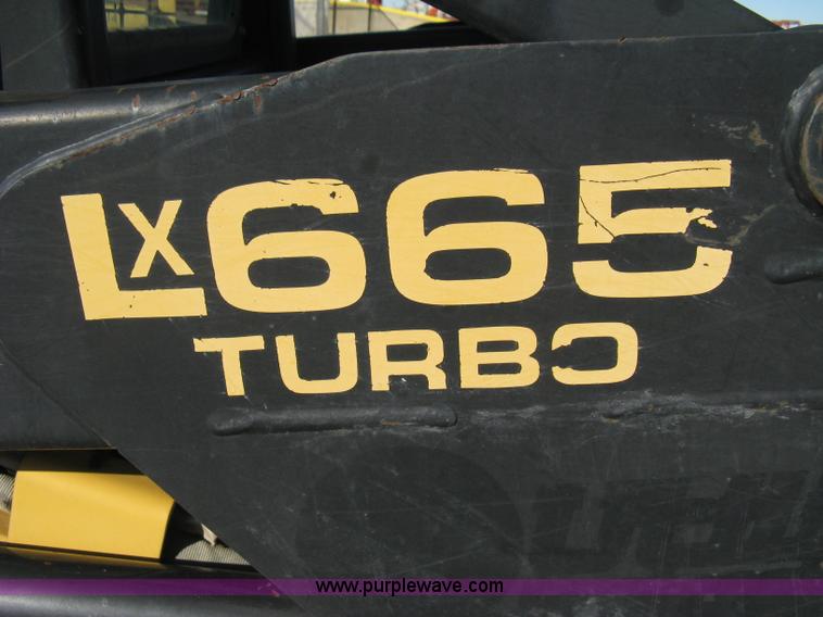 image for item A4472 1999 New Holland LX665 Turbo Super Boom skid loader