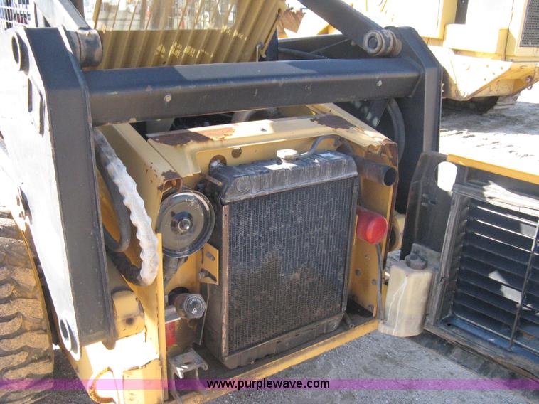 image for item A4472 1999 New Holland LX665 Turbo Super Boom skid loader