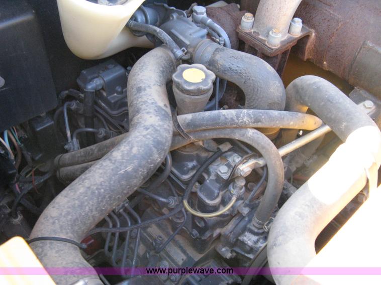 image for item A4472 1999 New Holland LX665 Turbo Super Boom skid loader