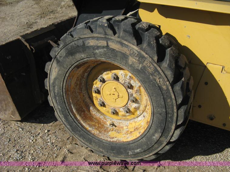 image for item A4472 1999 New Holland LX665 Turbo Super Boom skid loader