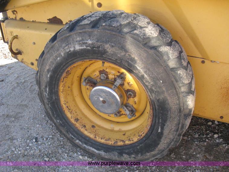 image for item A4472 1999 New Holland LX665 Turbo Super Boom skid loader