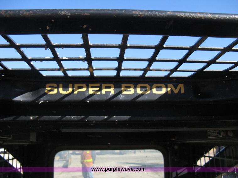 image for item A4472 1999 New Holland LX665 Turbo Super Boom skid loader