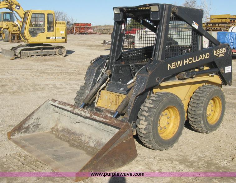 image for item A4473 1999 New Holland LX665 Turbo Super Boom skid loader