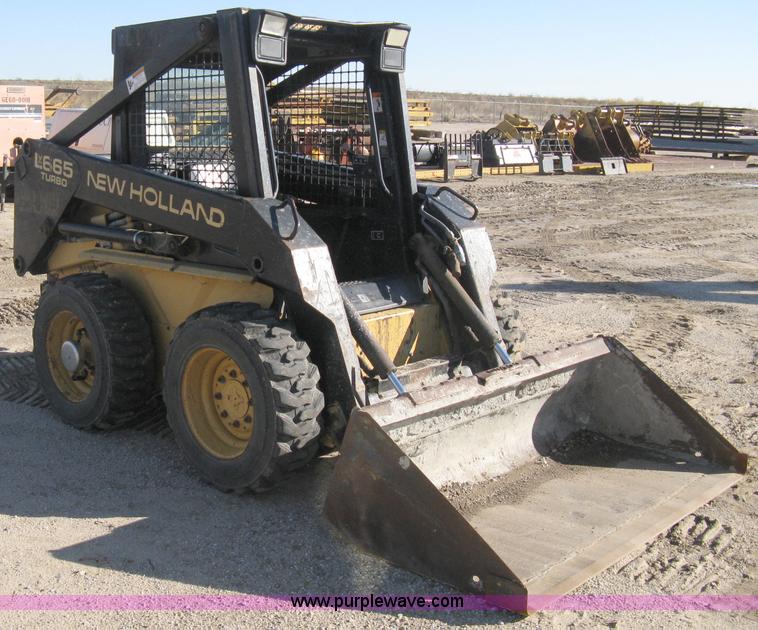 image for item A4473 1999 New Holland LX665 Turbo Super Boom skid loader