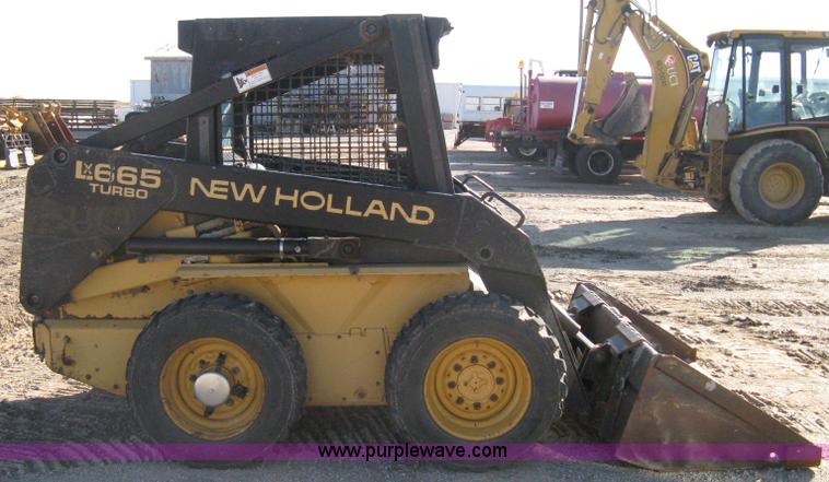 image for item A4473 1999 New Holland LX665 Turbo Super Boom skid loader