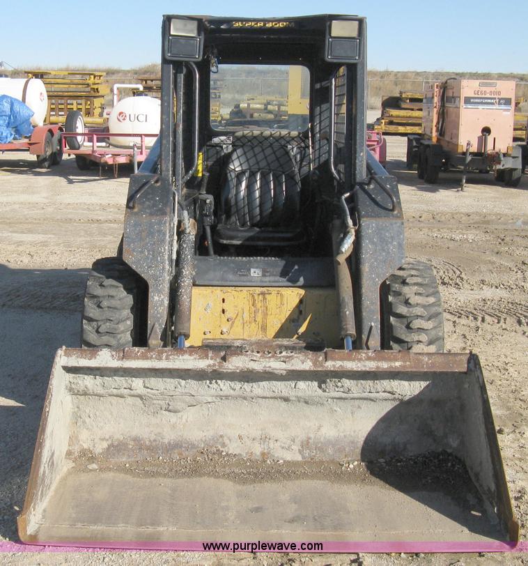 image for item A4473 1999 New Holland LX665 Turbo Super Boom skid loader