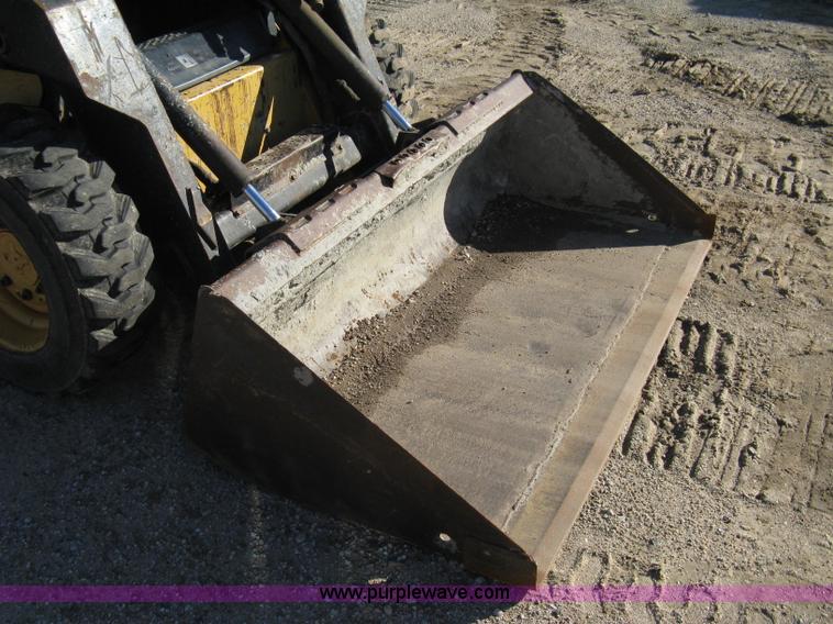 image for item A4473 1999 New Holland LX665 Turbo Super Boom skid loader