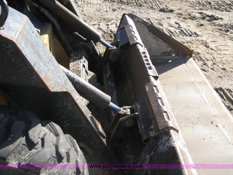 image for item A4473 1999 New Holland LX665 Turbo Super Boom skid loader