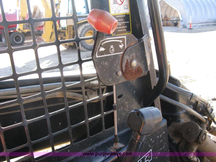 image for item A4473 1999 New Holland LX665 Turbo Super Boom skid loader