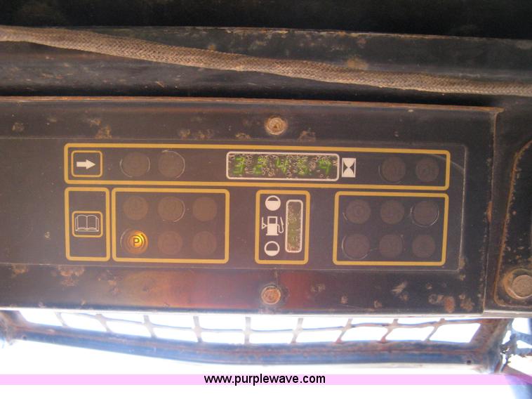 image for item A4473 1999 New Holland LX665 Turbo Super Boom skid loader