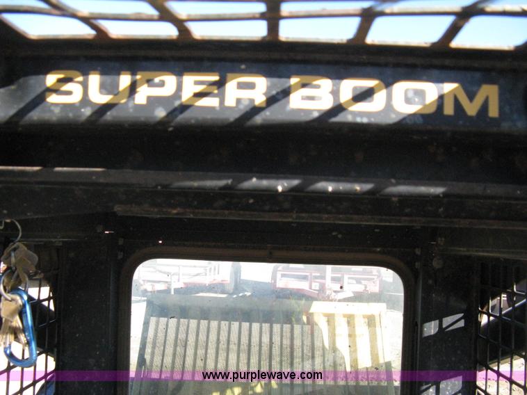 image for item A4473 1999 New Holland LX665 Turbo Super Boom skid loader