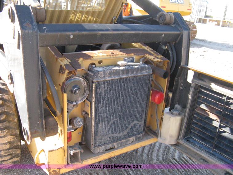 image for item A4473 1999 New Holland LX665 Turbo Super Boom skid loader