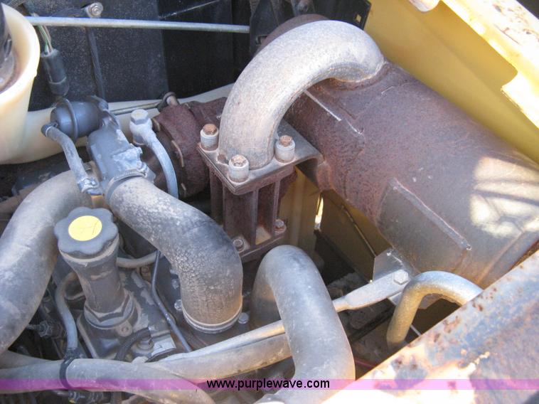 image for item A4473 1999 New Holland LX665 Turbo Super Boom skid loader