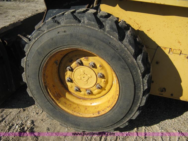 image for item A4473 1999 New Holland LX665 Turbo Super Boom skid loader