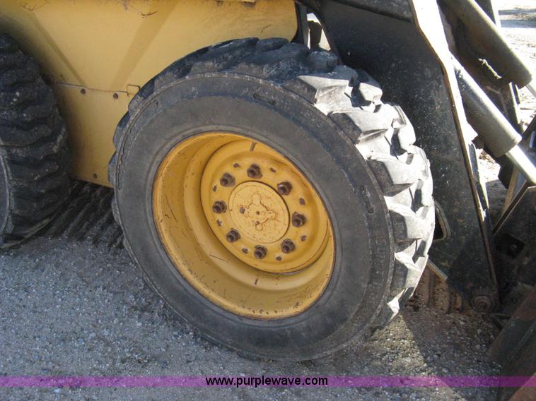 image for item A4473 1999 New Holland LX665 Turbo Super Boom skid loader