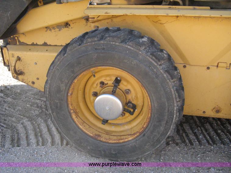 image for item A4473 1999 New Holland LX665 Turbo Super Boom skid loader