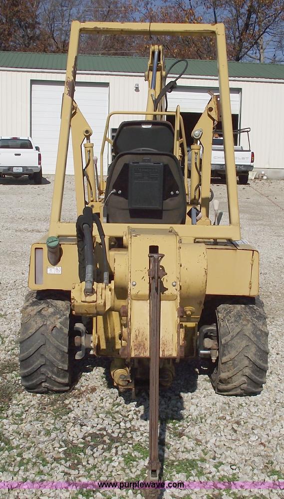 image for item C5754 Vermeer V3550A vibratory plow with backhoe