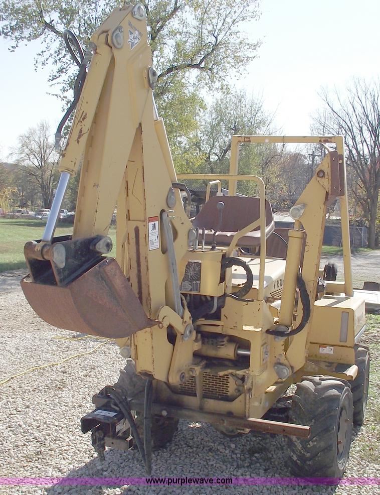 image for item C5754 Vermeer V3550A vibratory plow with backhoe