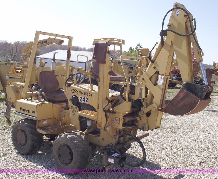 image for item C5754 Vermeer V3550A vibratory plow with backhoe