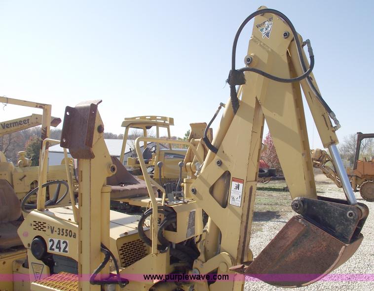 image for item C5754 Vermeer V3550A vibratory plow with backhoe