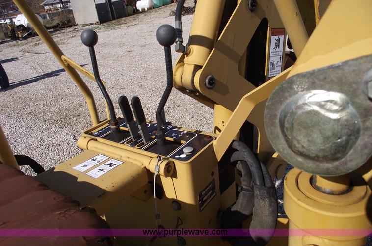 image for item C5754 Vermeer V3550A vibratory plow with backhoe