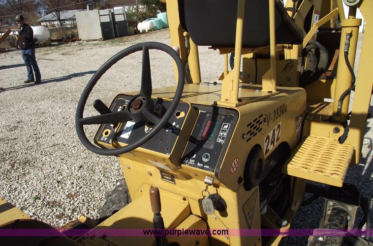 image for item C5754 Vermeer V3550A vibratory plow with backhoe