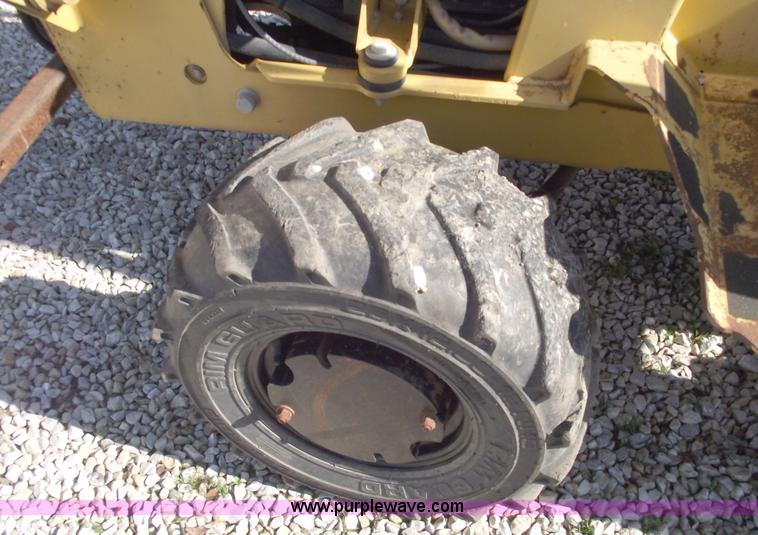 image for item C5754 Vermeer V3550A vibratory plow with backhoe