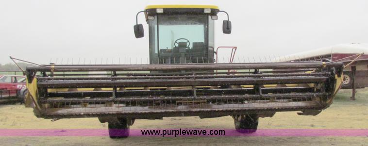 image for item A3511 2000 New Holland HW320 self propelled swather