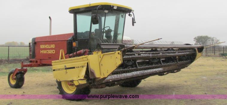image for item A3511 2000 New Holland HW320 self propelled swather
