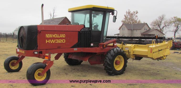 image for item A3511 2000 New Holland HW320 self propelled swather