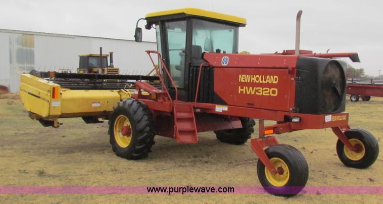 image for item A3511 2000 New Holland HW320 self propelled swather