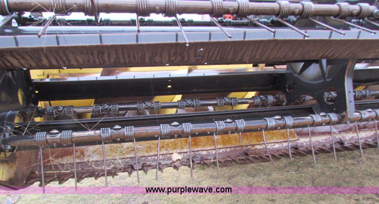 image for item A3511 2000 New Holland HW320 self propelled swather