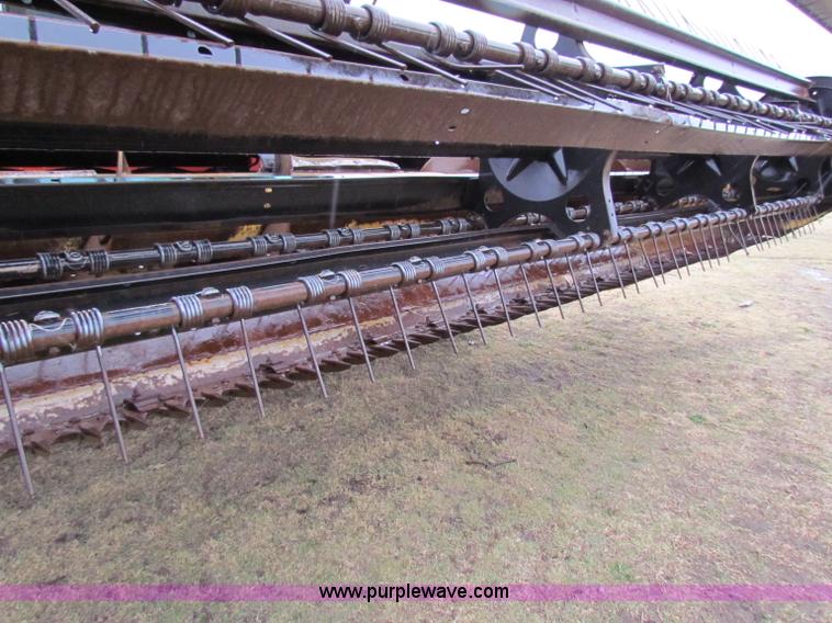 image for item A3511 2000 New Holland HW320 self propelled swather