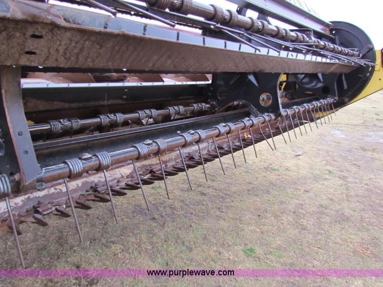 image for item A3511 2000 New Holland HW320 self propelled swather