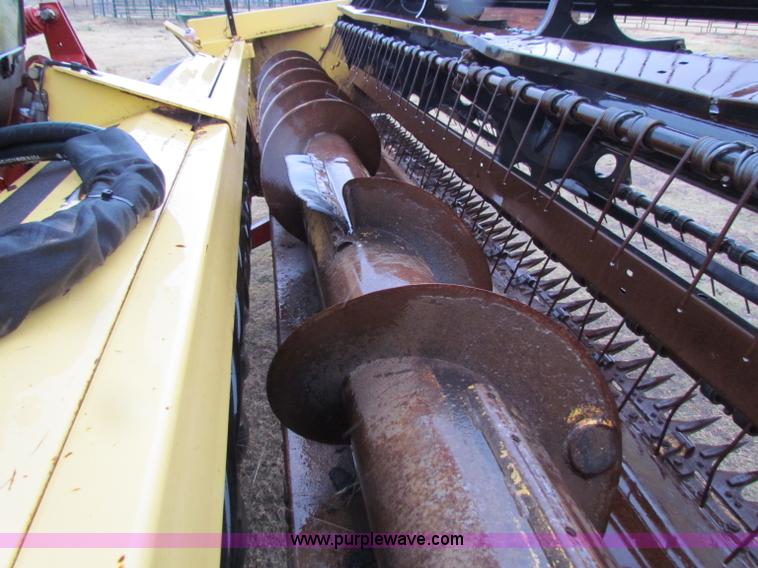 image for item A3511 2000 New Holland HW320 self propelled swather