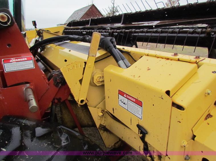 image for item A3511 2000 New Holland HW320 self propelled swather