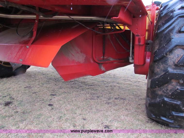 image for item A3511 2000 New Holland HW320 self propelled swather