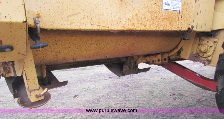 image for item A3511 2000 New Holland HW320 self propelled swather