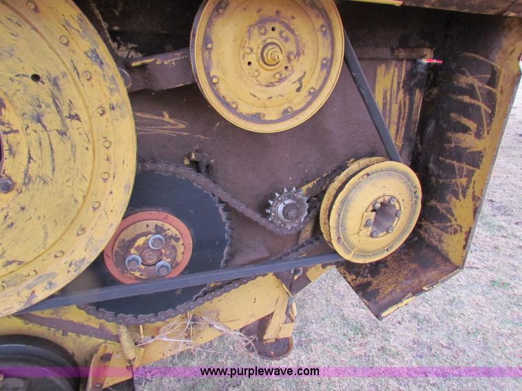 image for item A3511 2000 New Holland HW320 self propelled swather