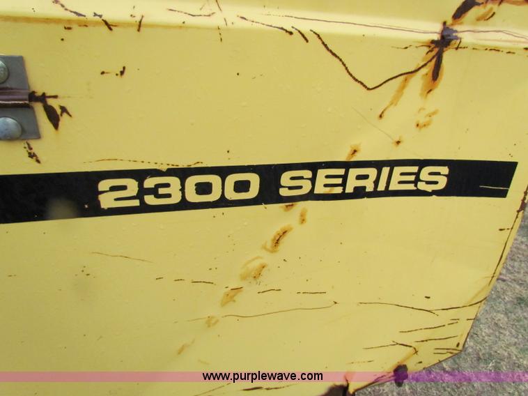 image for item A3511 2000 New Holland HW320 self propelled swather