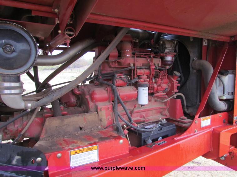 image for item A3511 2000 New Holland HW320 self propelled swather