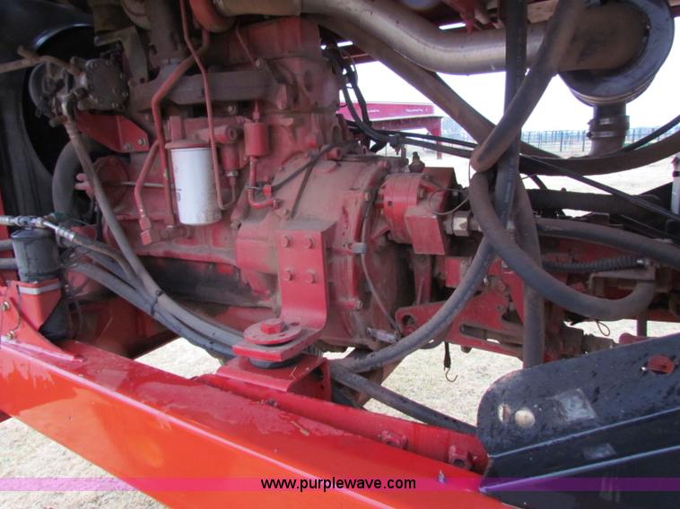 image for item A3511 2000 New Holland HW320 self propelled swather